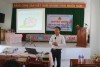 Đồng chí Nguyễn Minh Phát báo cáo tại buổi truyền thông về Luật và các chính sách liên quan đến phòng, chống mua bán người tại xã An Quang thuộc huyện An Lão