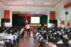 Đồng chí Phạm Hồng Hải báo cáo tại buổi truyền thông phòng chống xâm hại tình dục trẻ em ở xã Phước Hưng, huyện Tuy Phước