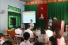 Đồng chí Nguyễn Xuân Thao báo cáo tại buổi truyền thông phòng chống xâm hại tình dục trẻ em ở xã Phước Lộc, huyện Tuy Phước